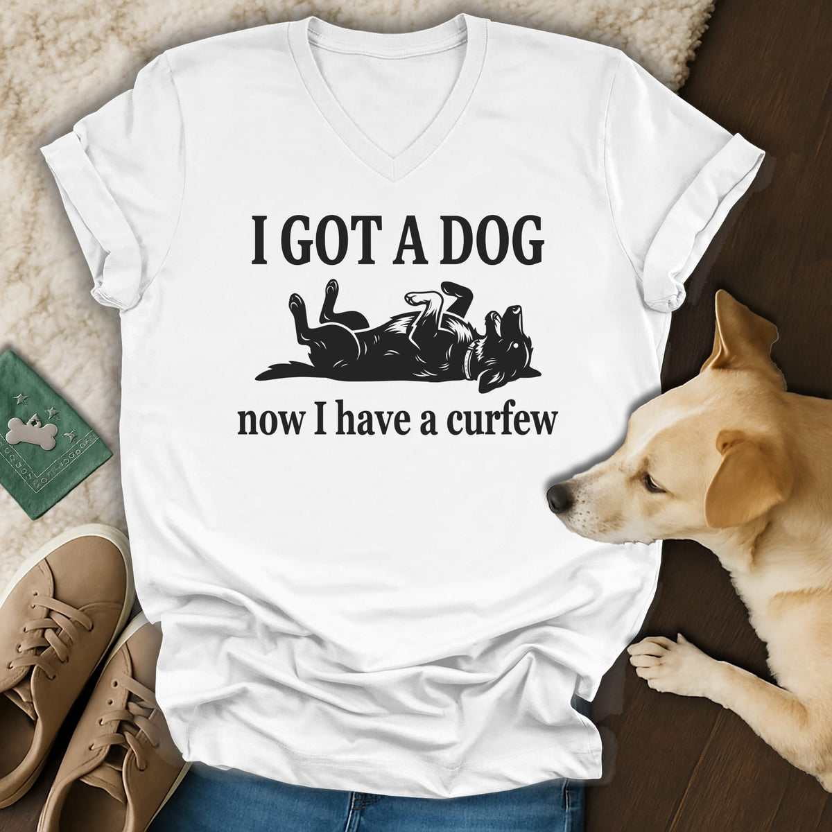 White t-shirt with black text "I GOT A DOG now I have a curfew" and a dog graphic.
