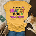 Yellow t-shirt with text "WORLD'S OKAYEST DOG TRAINER".