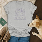 Grey t-shirt with purple line art of a dog and flowers, reads "FIND YOUR PEACE Preferably with a dog."