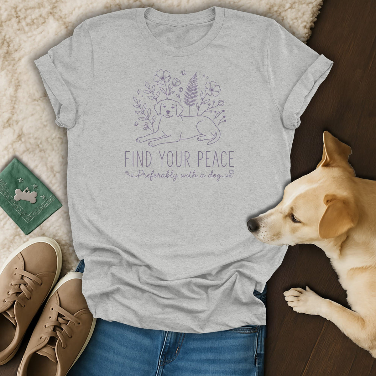 Grey t-shirt with purple line art of a dog and flowers, reads "FIND YOUR PEACE Preferably with a dog."