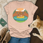 T-shirt graphic of a dog relaxing in a kiddie pool, with a dog in foreground.