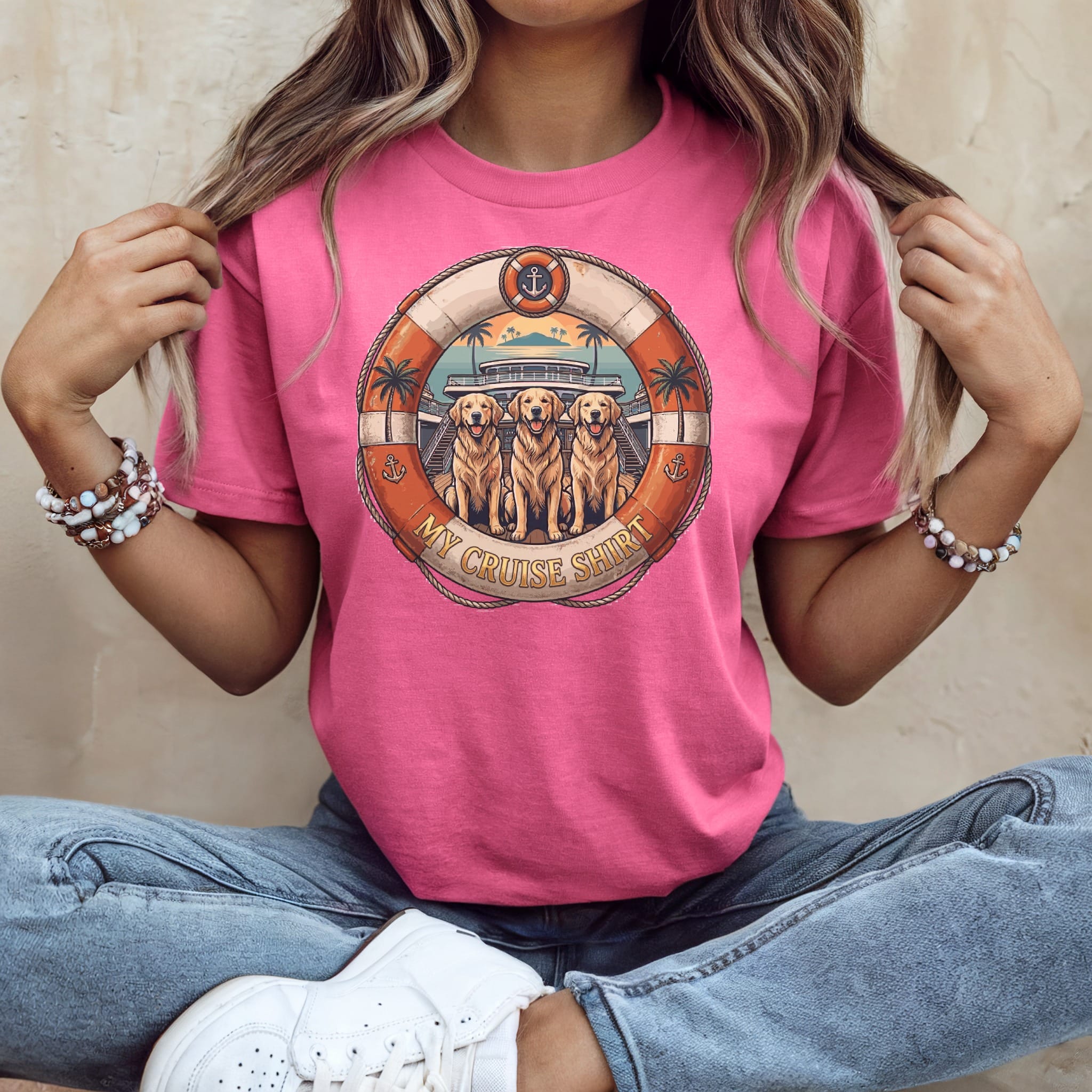 Three golden retrievers in a life preserver circle on a pink cruise shirt.