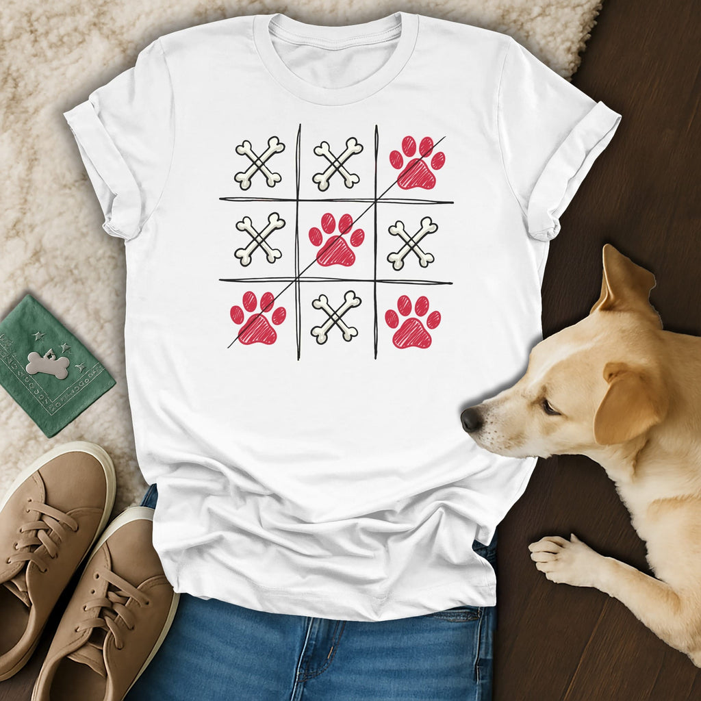 White t-shirt with tic-tac-toe game art featuring paw prints and bones.