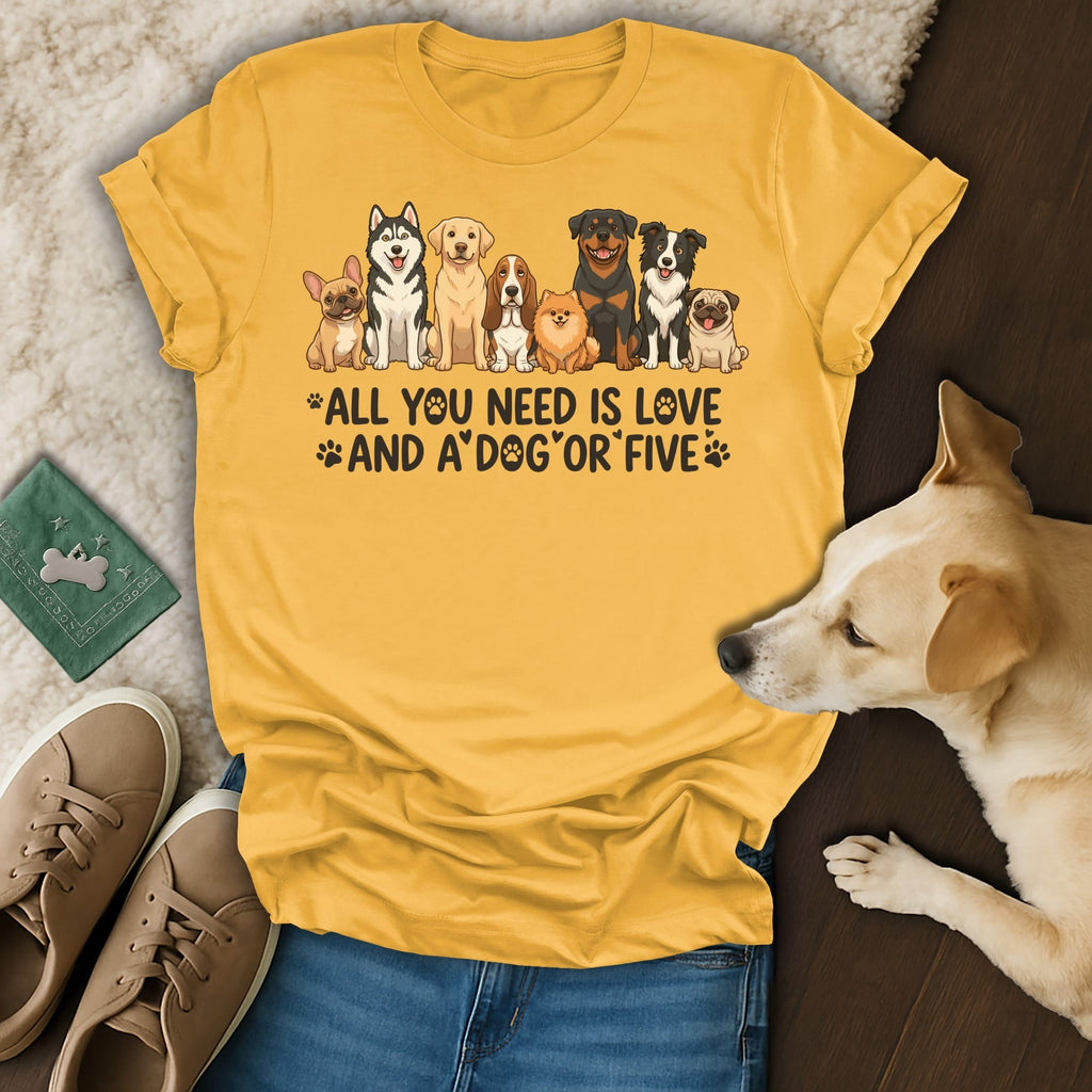 T-shirt with text "All you need is love and a dog or five" and diverse dog illustrations.