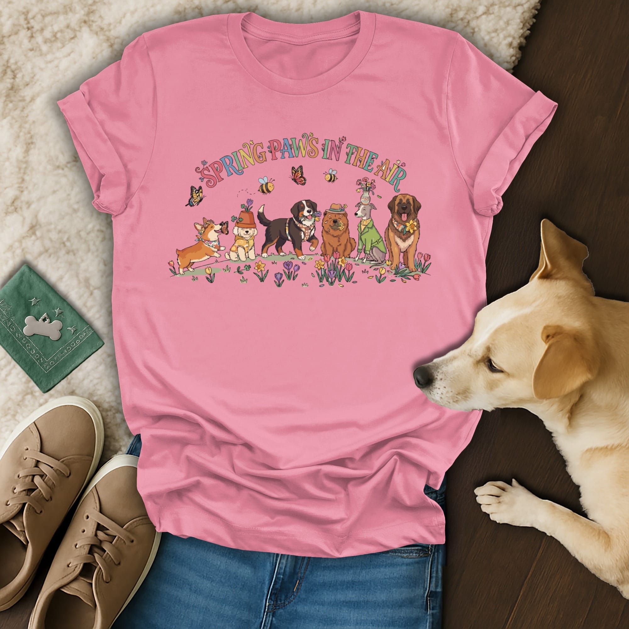 Spring Paws in the Air graphic on a pink t-shirt with dogs and flowers.