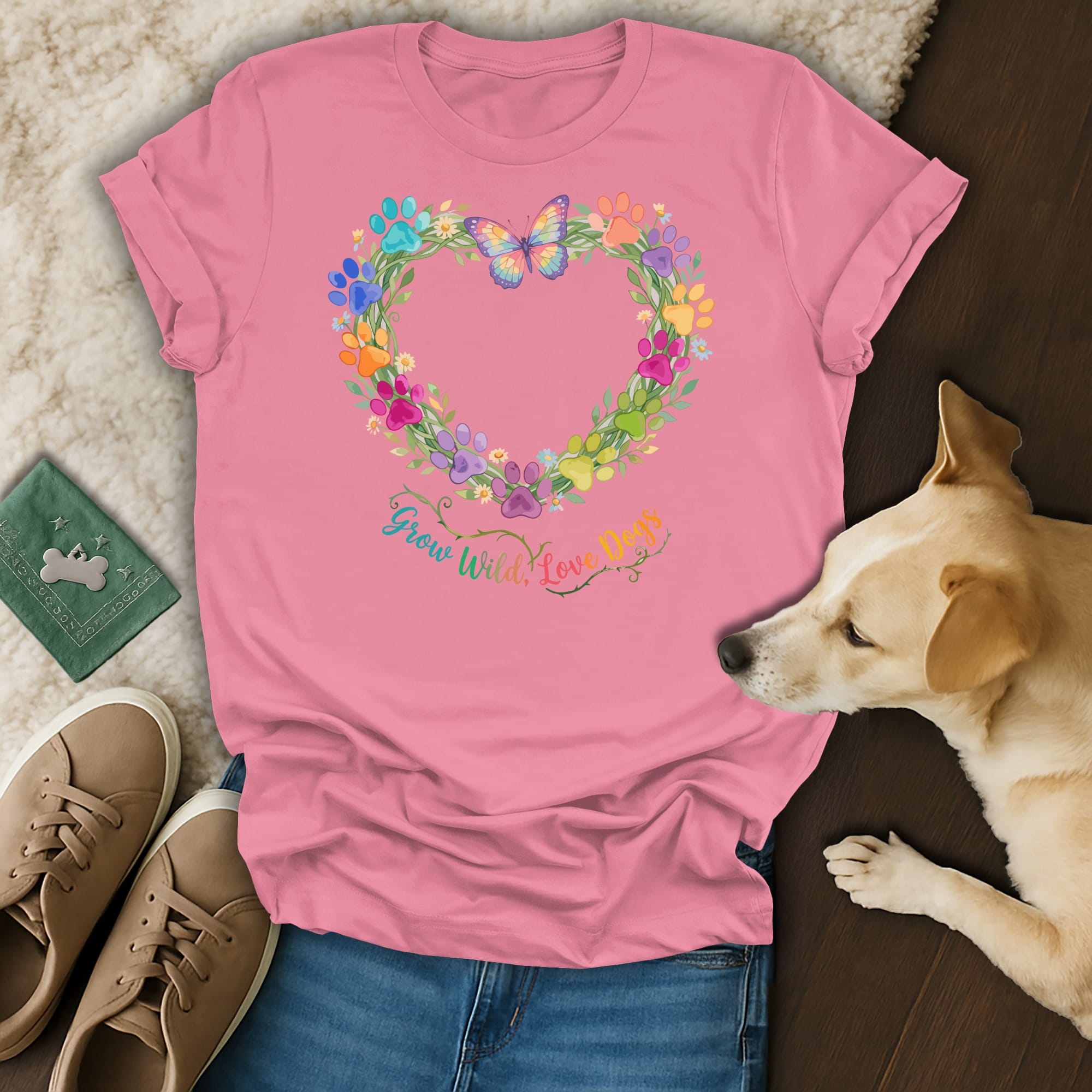 Pink t-shirt with colorful paw print heart graphic and butterfly, text "Grow Wild, Love Dogs".