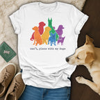 White t-shirt with rainbow-colored dogs and text "can't, plans with my dogs".