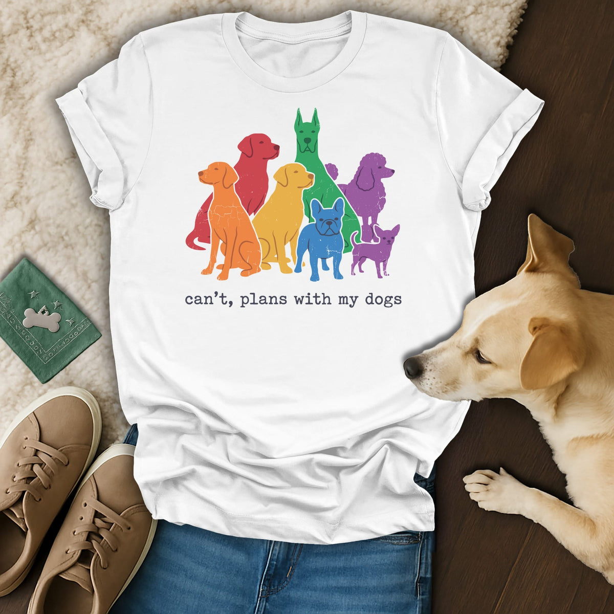 White t-shirt with rainbow-colored dogs and text "can't, plans with my dogs".
