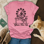 Pink t-shirt with "Glam-Fur-Us" text and illustration of a dog at a vanity.