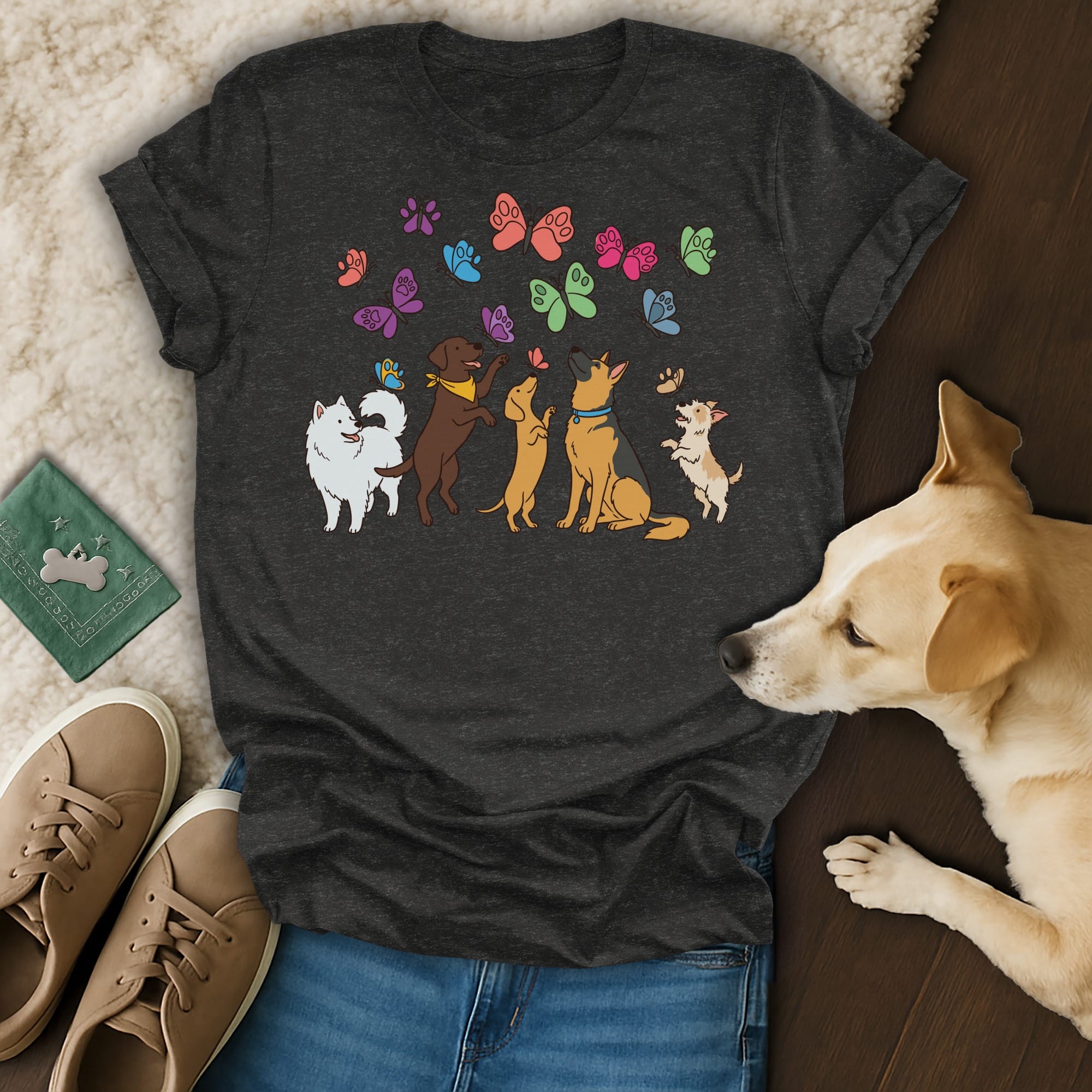 T-shirt with colorful cartoon dogs and butterflies graphic.