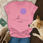 Pink t-shirt with a minimalist dog silhouette on a hill under a purple moon.