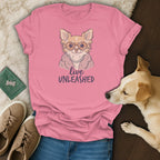 Pink t-shirt with a chihuahua wearing glasses and a pearl necklace, text "live UNLEASHED".