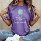 Purple t-shirt with "Night Patrol" text, dog on surfboard under moon.