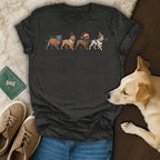 Dark gray t-shirt featuring four dogs in holiday costumes: pumpkin, pilgrim, Santa, and party.