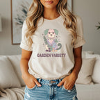 Light beige t-shirt with a floral dog graphic and "GARDEN VARIETY" text.
