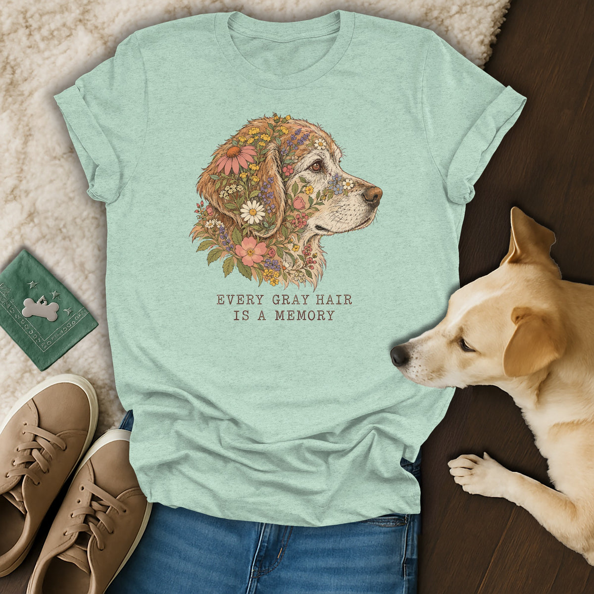 A light green t-shirt featuring a golden retriever graphic surrounded by flowers and the text Every Gray Hair Is A Memory.