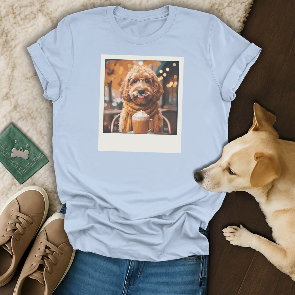 Light blue t-shirt with a dog wearing glasses and scarf holding a drink.