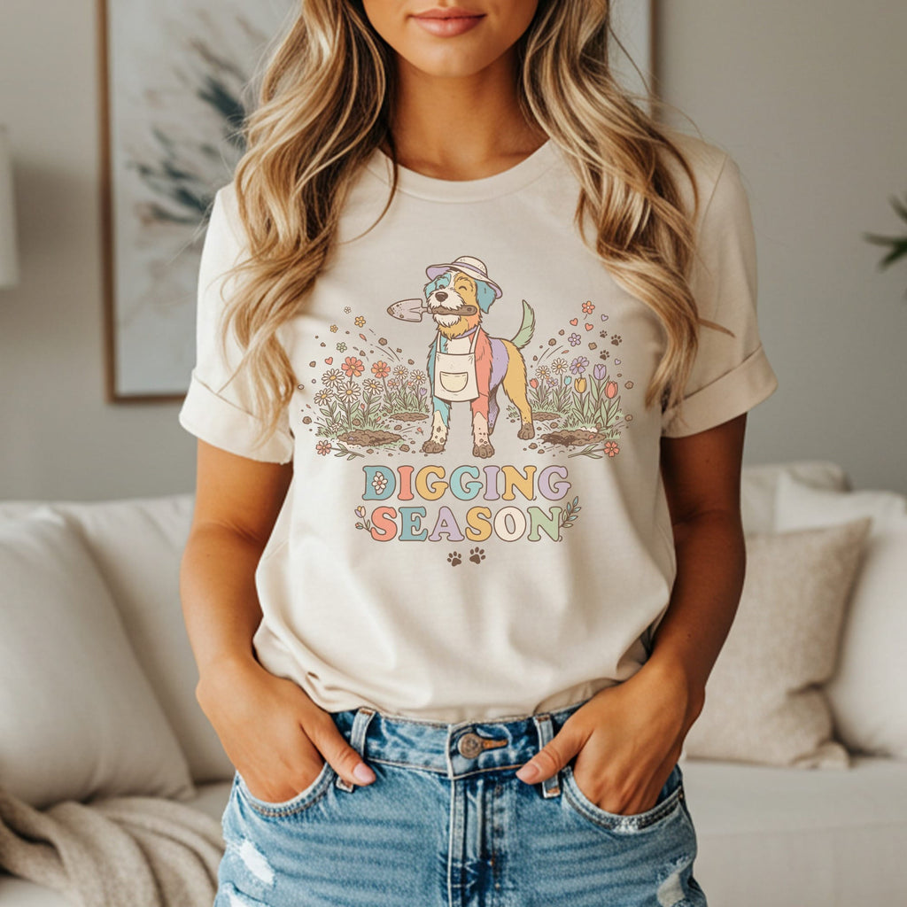 Graphic tee with dog in garden holding shovel, reads "Digging Season".