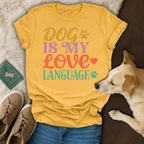 Yellow t-shirt with "Dog Is My Love Language" text and dog paw prints.