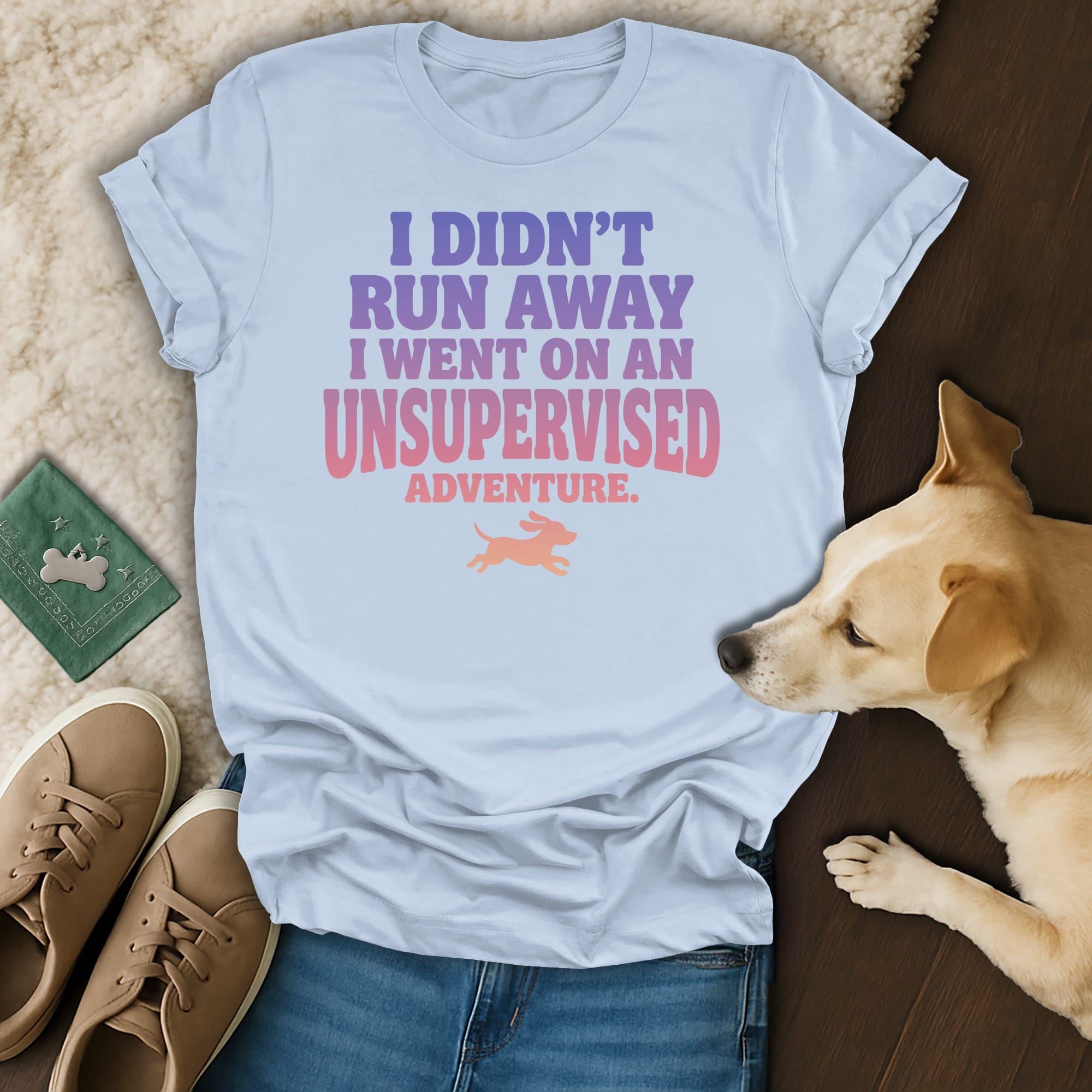 Light blue t-shirt with "I Didn't Run Away I Went On An Unsupervised Adventure" text.