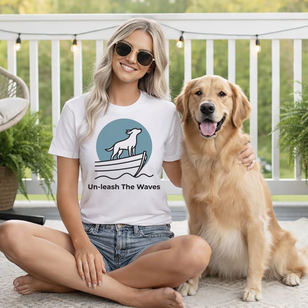 Woman and golden retriever wear t-shirt with nautical dog logo and text.