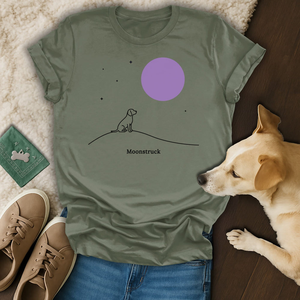 Olive green t-shirt with "Moonstruck" text and a minimalist dog silhouette under a purple moon.