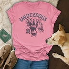 Pink t-shirt with "UNDERDOGS" text and three dogs.