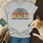 T-shirt with three dogs and text "Guarded the Pharaohs. Sailed with Vikings. Currently Chasing Squirrels."