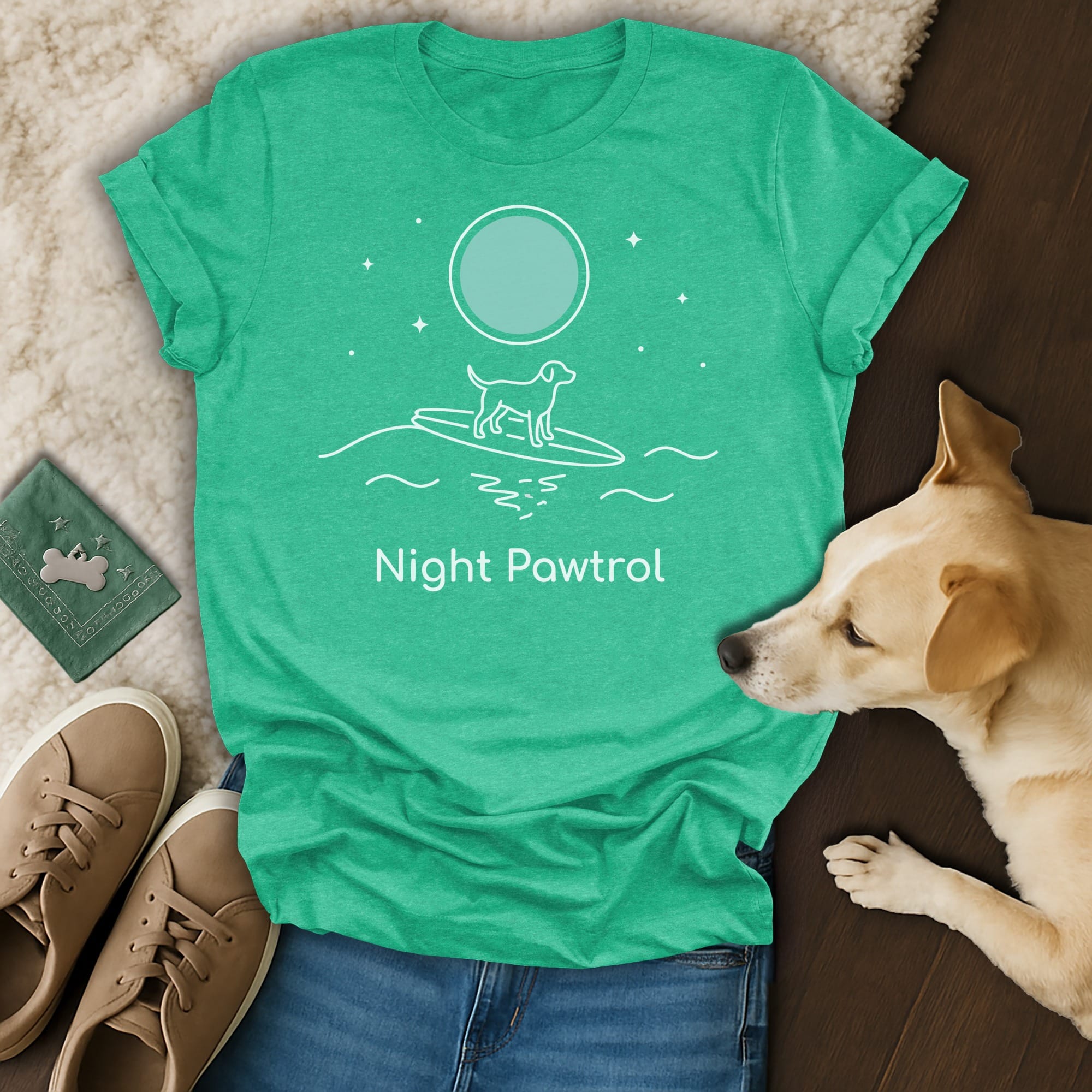 Green t-shirt with "Night Patrol" text and a dog surfing on waves under a moon.