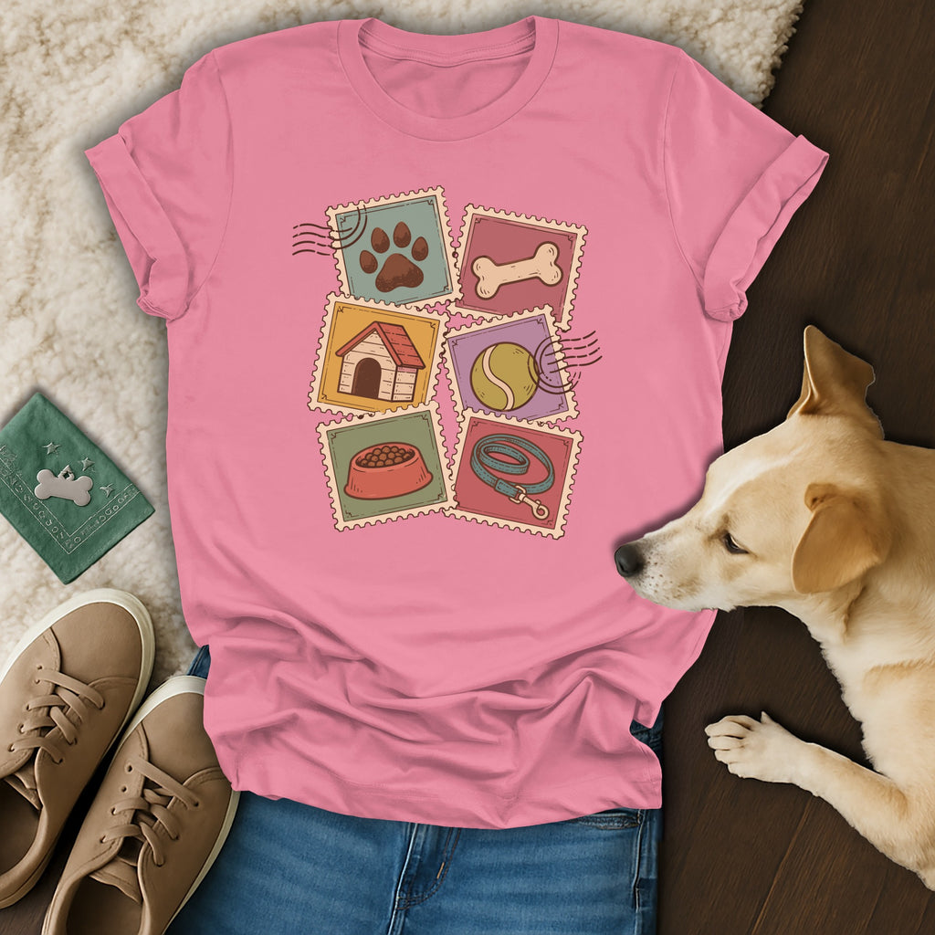 Pink t-shirt with a vintage dog postage stamp graphic, displayed alongside blue jeans, sneakers, and a real dog.