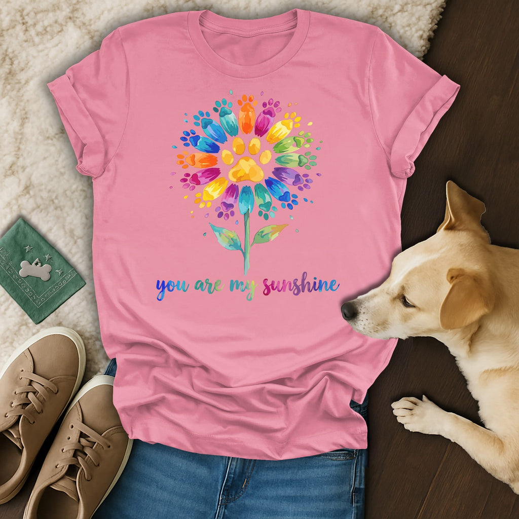 Pink t-shirt with colorful paw print flower and "you are my sunshine" text.