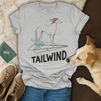 Greyhound on paper airplane with "TAILWIND" text.