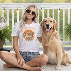 White t-shirt with "Woof Stock" graphic featuring dogs in a van.