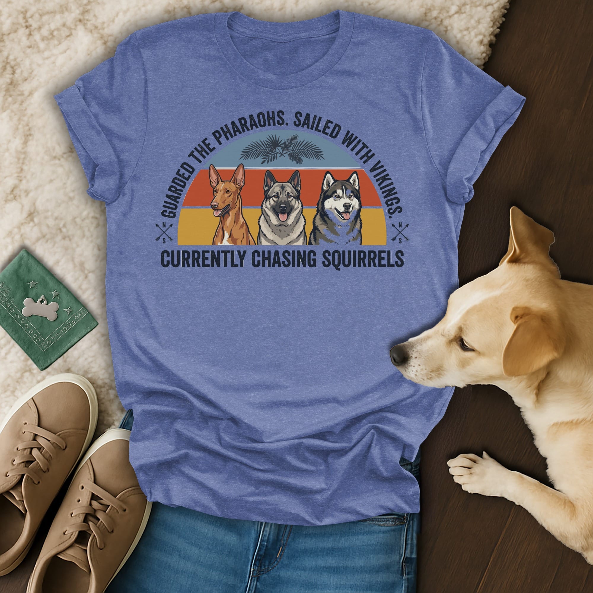 T-shirt with three dogs and text "Guarded the Pharaohs. Sailed with Vikings. Currently chasing squirrels."