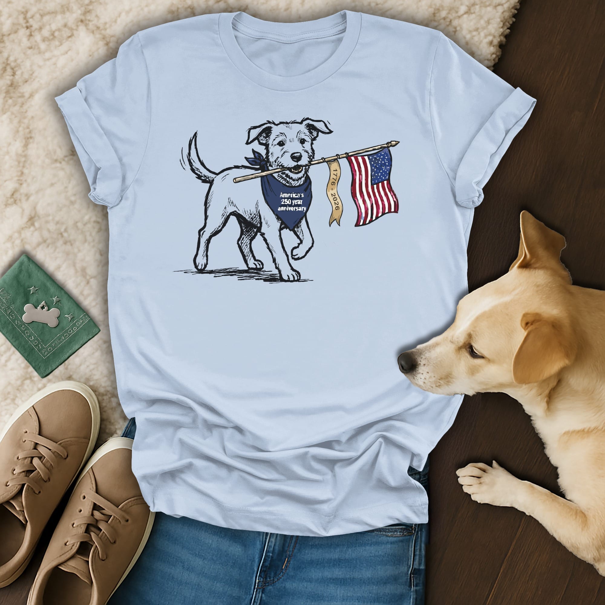 Light blue t-shirt with dog holding American flag and bandana.