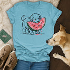 Light blue t-shirt with a graphic of a puppy eating a slice of watermelon.