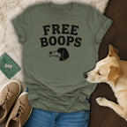 Olive t-shirt with "FREE BOOPS" text and dog head graphic.