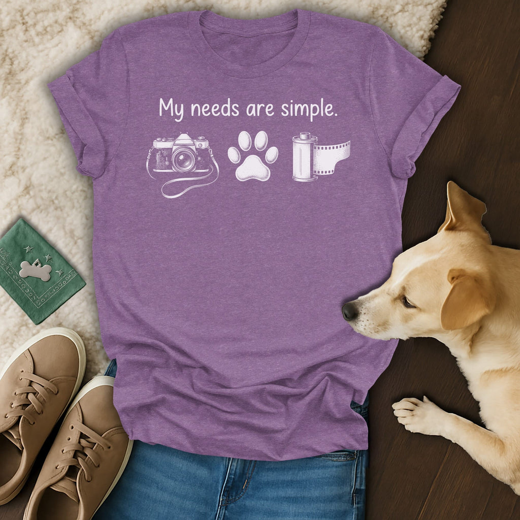 Purple t-shirt with white text and graphics of camera, paw print, and film roll.