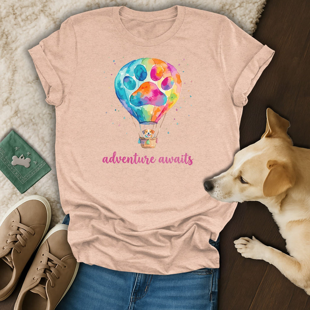 T-shirt with a colorful hot air balloon and dog, text reads "adventure awaits".