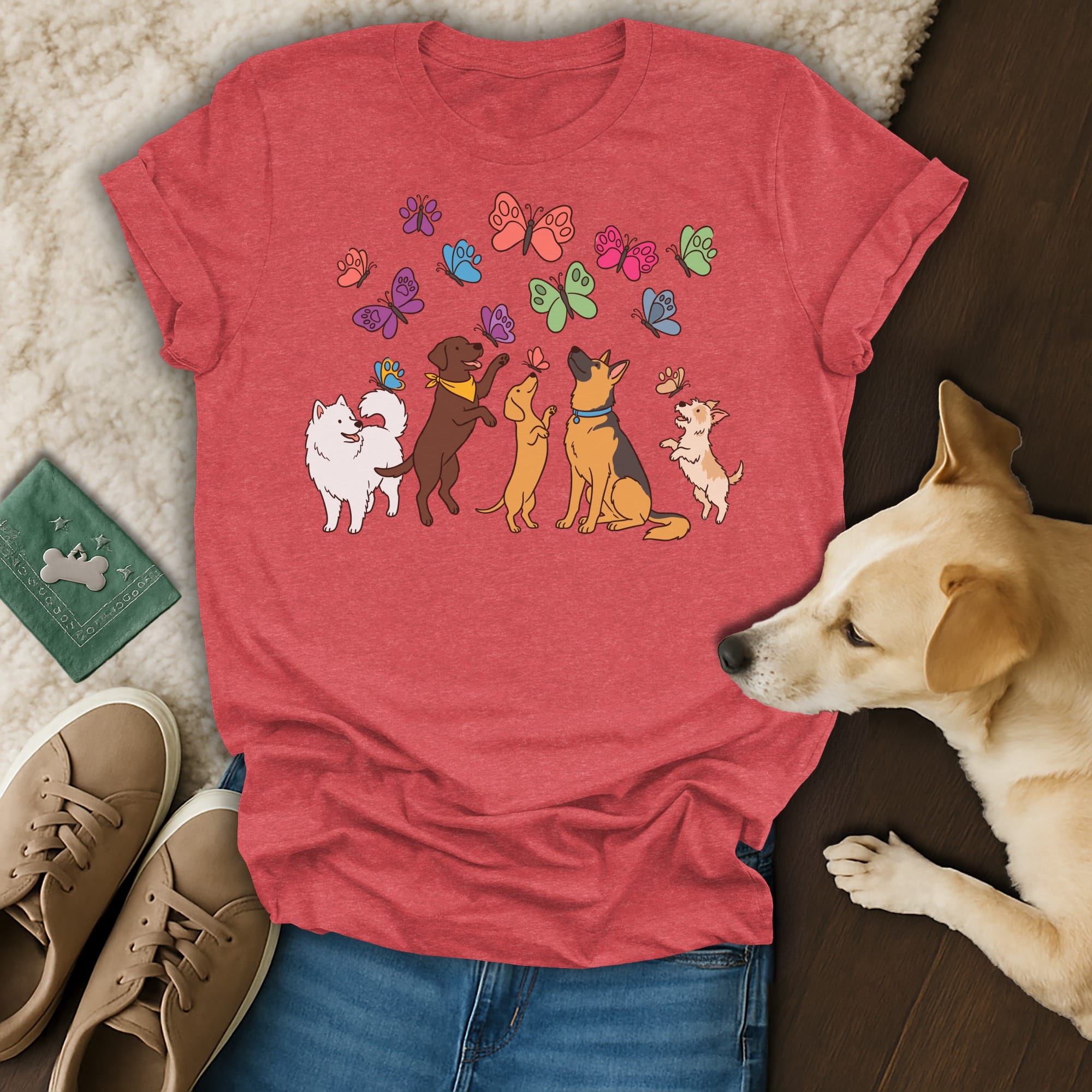 Red t-shirt with cute cartoon dogs and colorful butterflies printed on it.
