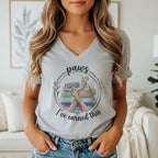 Graphic on t-shirt with dog paws, sunglasses, drink, and "paws I've earned this".