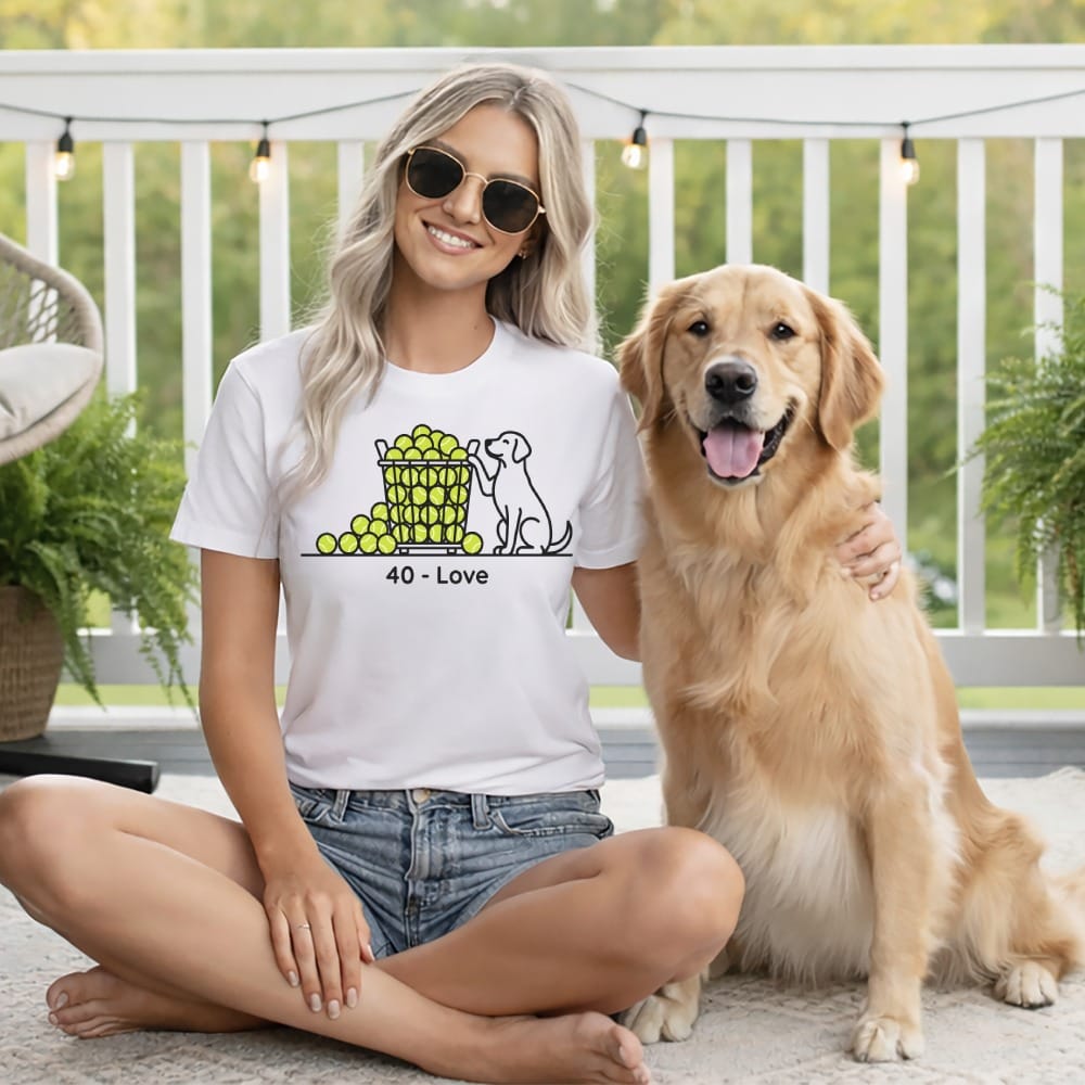 Woman with dog wearing shirt with tennis ball graphic and text "40 - Love".