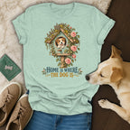 Mint green t-shirt with a graphic of a dog in a birdhouse and text that reads "Home is where the dog is."