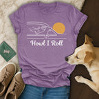 Purple t-shirt with "Howl I Roll" text and a dog running towards a sun.
