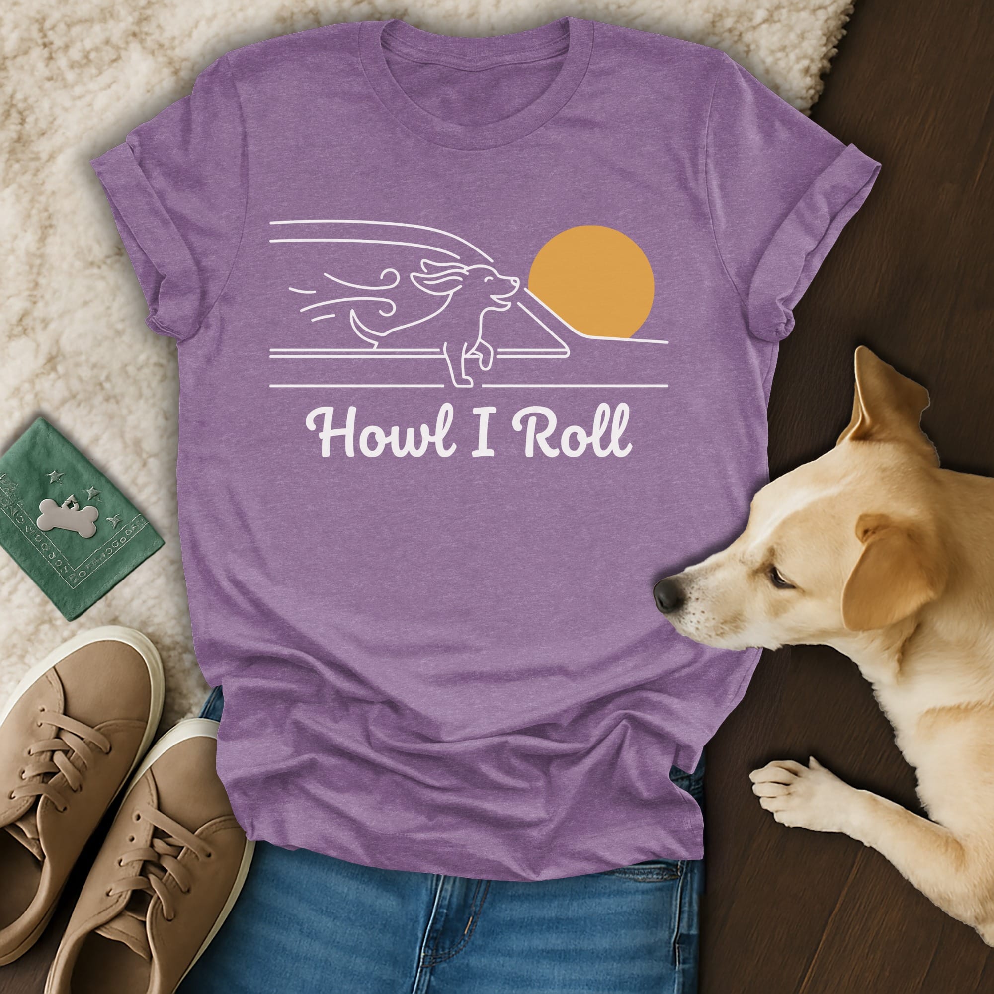 Purple t-shirt with "Howl I Roll" text and a dog running towards a sun.
