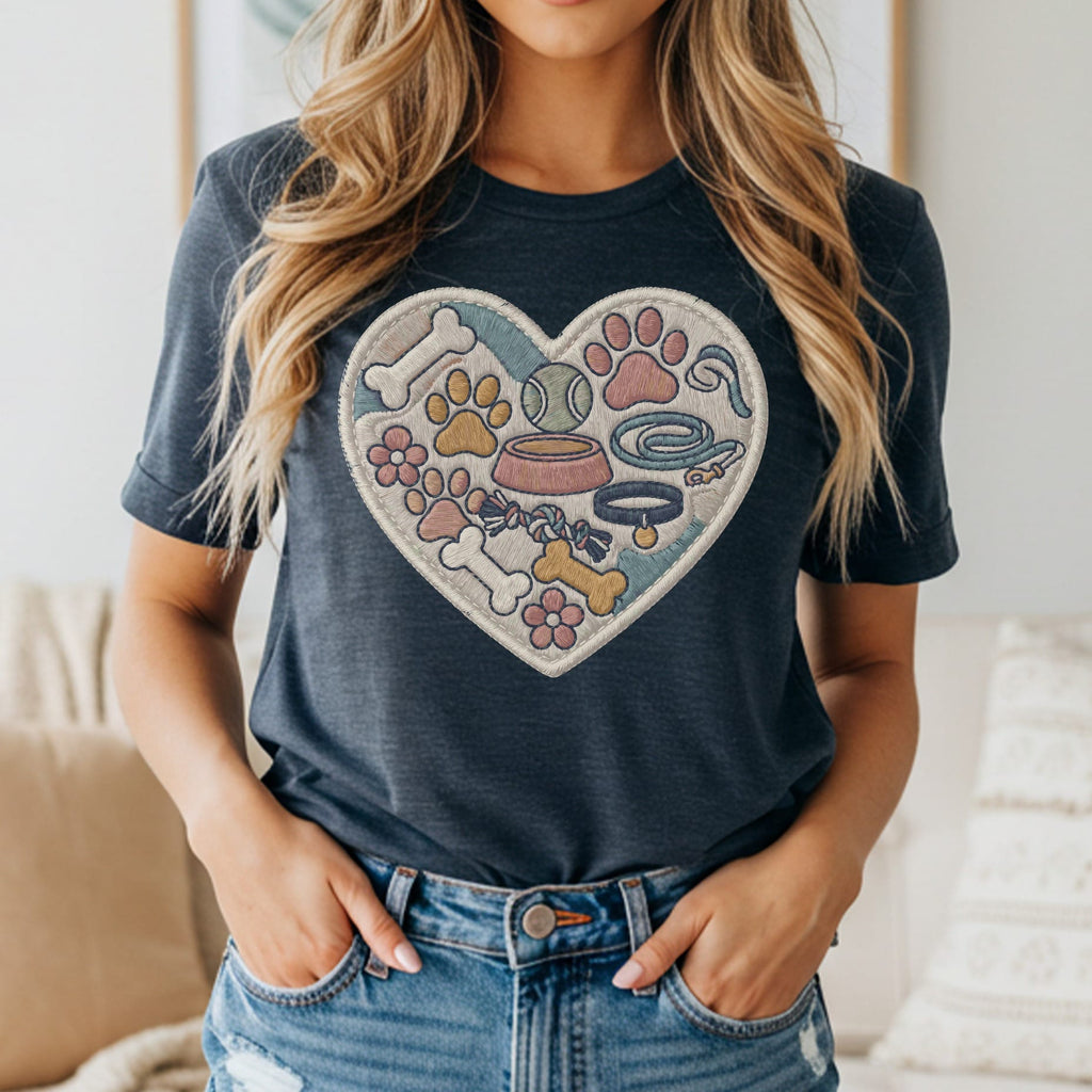 Heart-shaped graphic on a t-shirt with dog bones, paws, leash, and collar.
