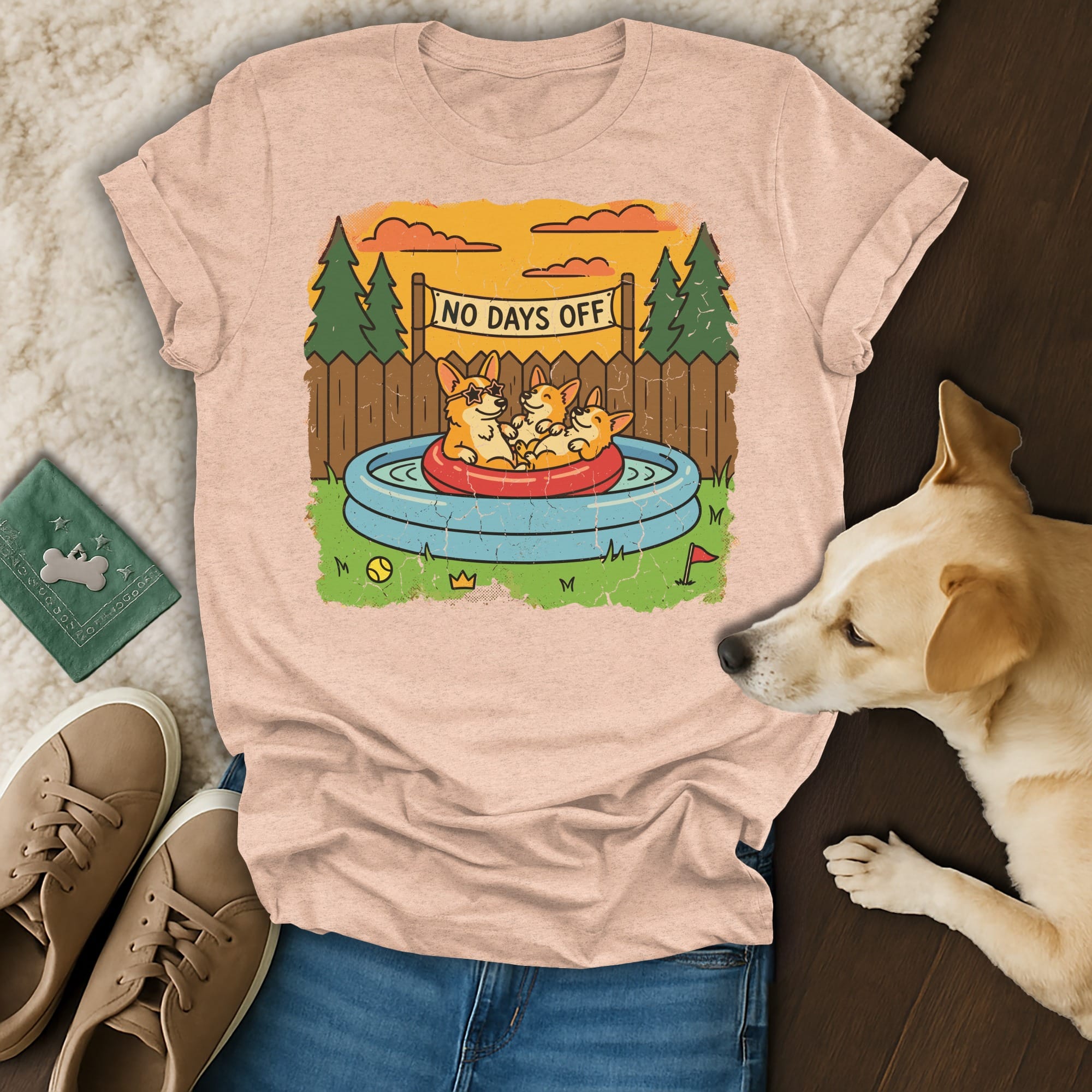 T-shirt with cartoon corgis in a kiddie pool, reading "No Days Off."