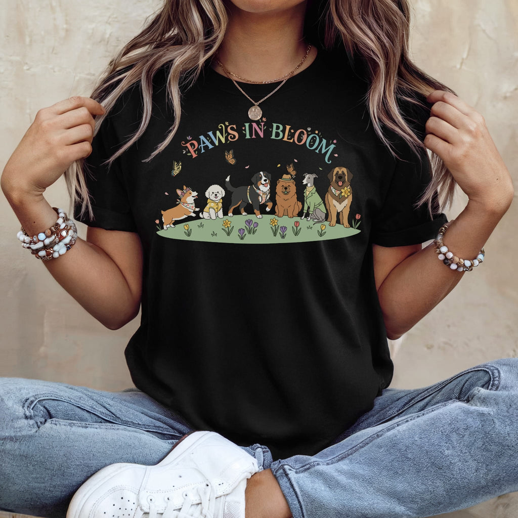 Black t-shirt with "Paws in Bloom" and dogs in a field with butterflies.