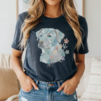 Abstract mosaic dog portrait with pastel flowers on a dark grey t-shirt.