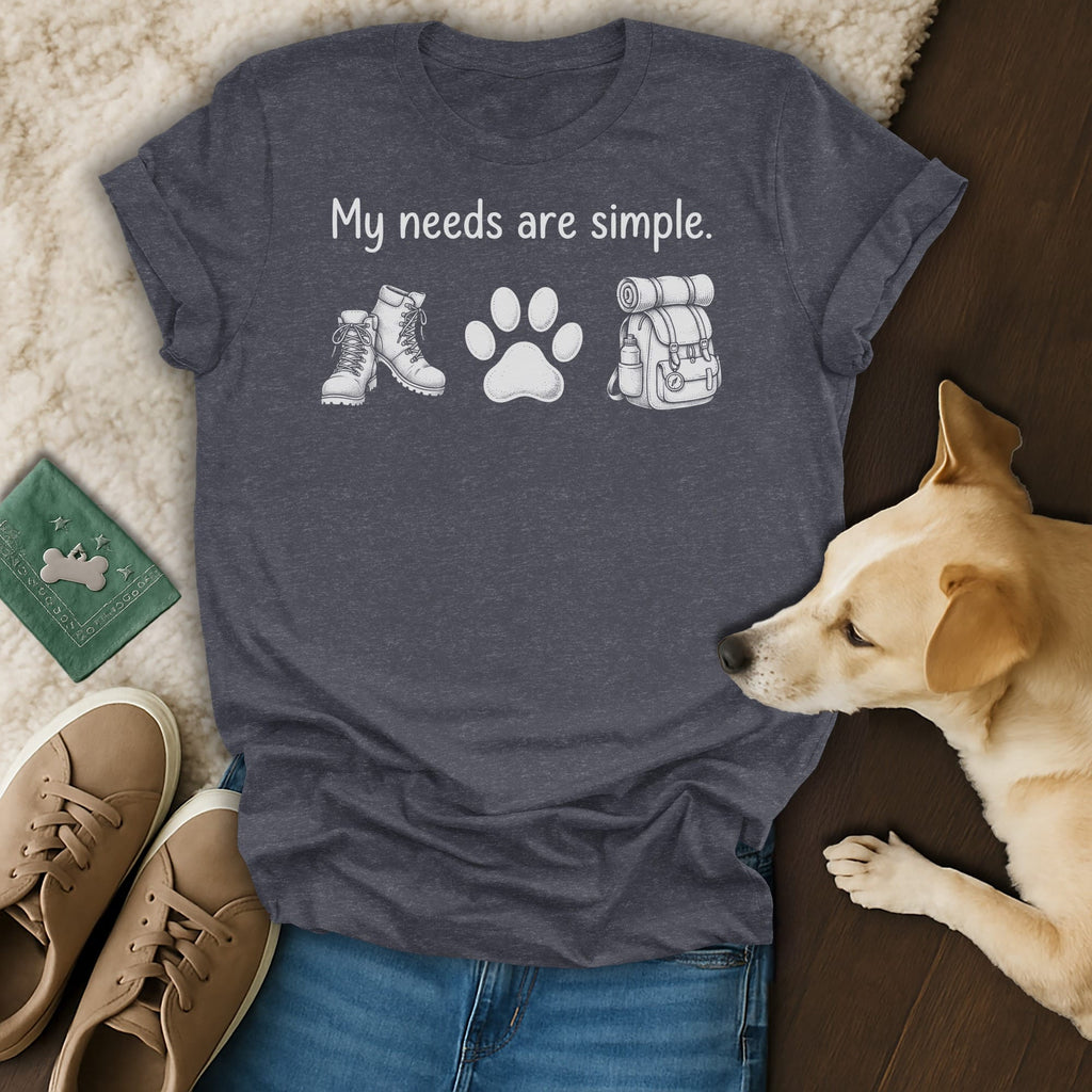 Dark grey t-shirt with "My needs are simple." above hiking boots, paw print, and backpack.